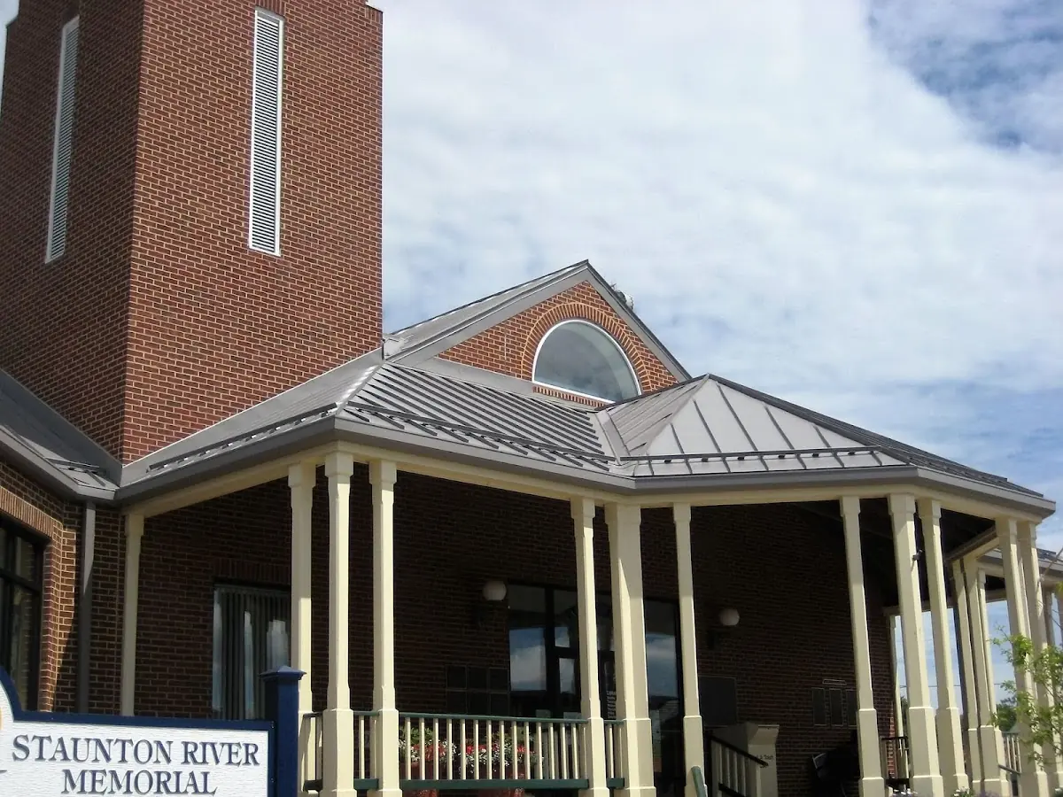 Skilled roofing craftsmen working on a residential roof in Bowers